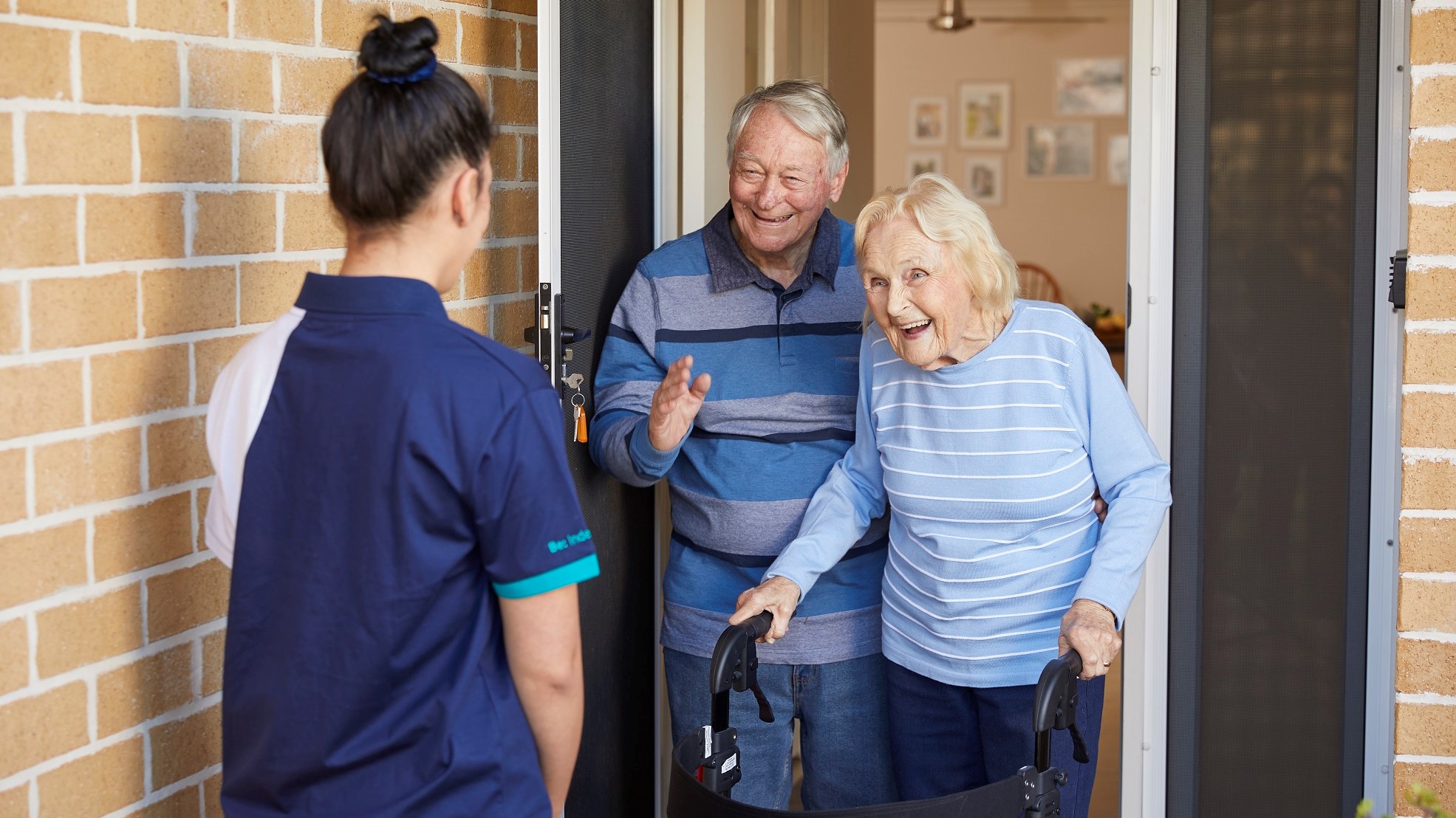 elderly couple walker front door care staff